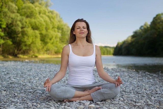 A woman doing meditation (dhyana)